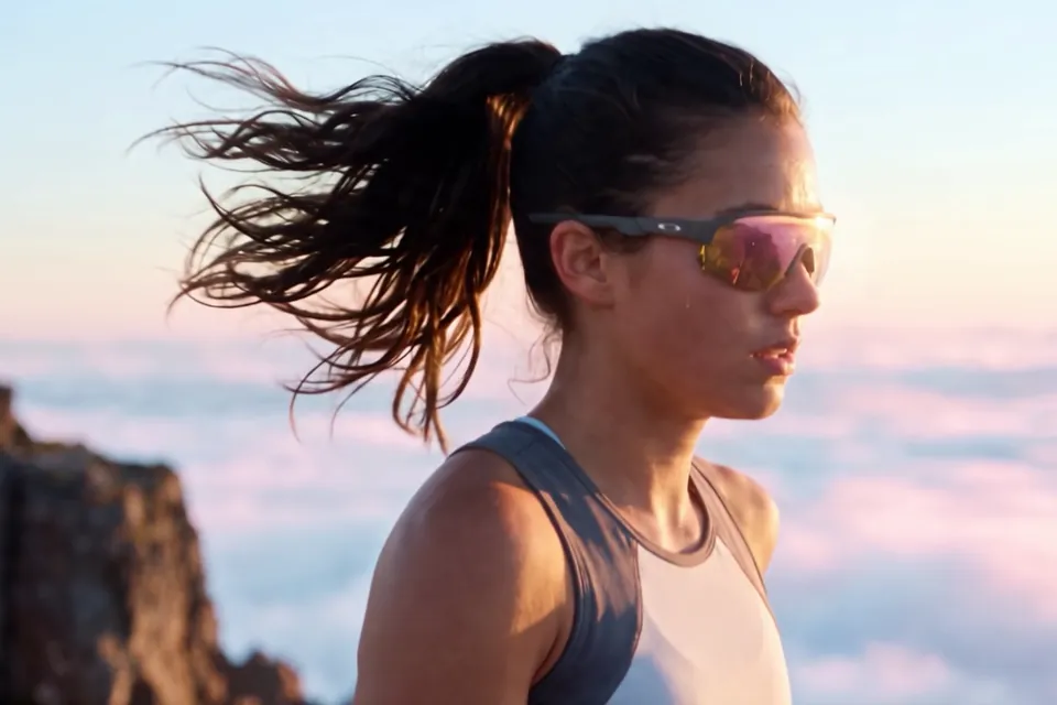 A runner above the clouds at golden hour